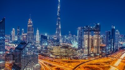 The Burj Khalifa rising above the illuminated skyline of Downtown Dubai at night
